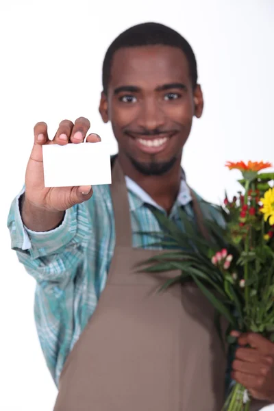 Fleuriste masculin avec carte de visite — Photo