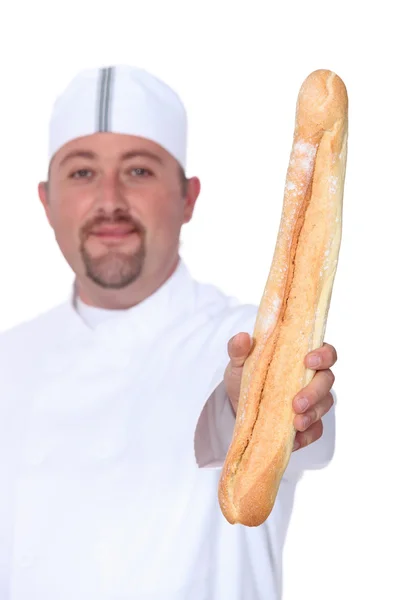 Panettiere con pane in mano — Foto Stock