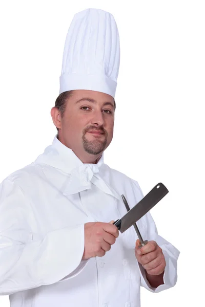 Kucharz, ostrzenie noża — Zdjęcie stockowe