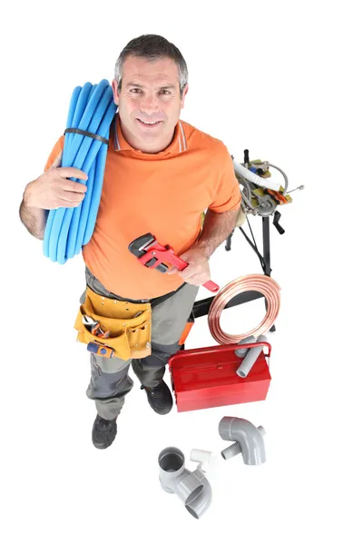 Plumber with tools of the trade Stock Image