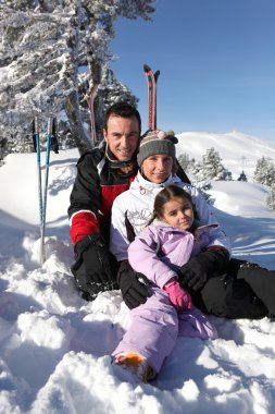 Family on a skiing holiday clipart