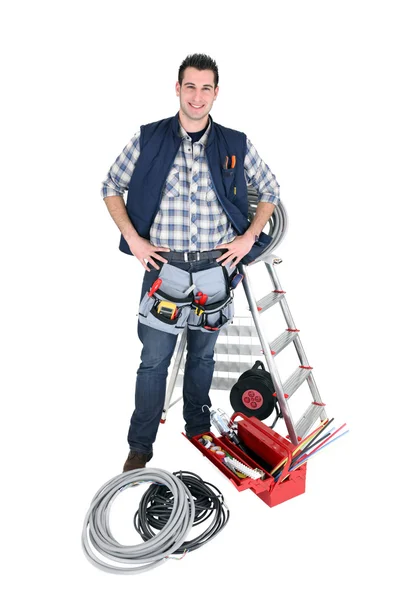 Eletricista com caixa de ferramentas e escada rolante — Fotografia de Stock