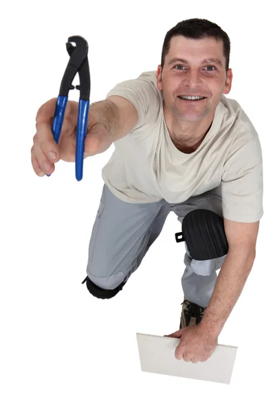 Man preparing to cut tile — Stock Photo, Image