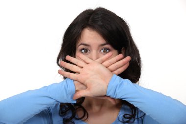 Young brunette hiding her mouth clipart