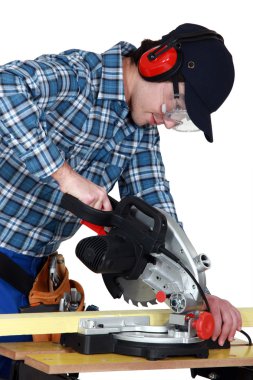 Man using a miter saw clipart