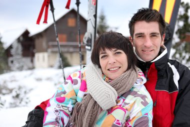 Couple on a skiing vacation clipart