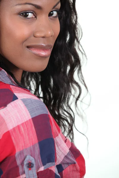 Pretty young woman in a checked shirt — Stock Photo, Image