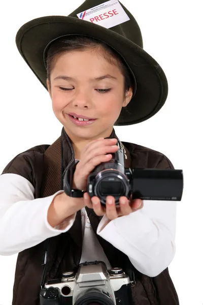 Portrait of a little girl dressed as a photographer — Stock Photo, Image