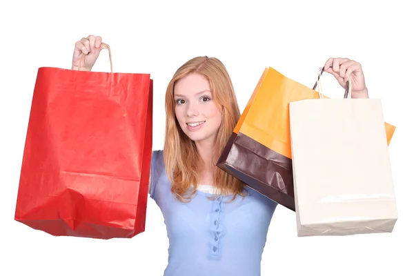 Redhead girl with bags — Stock Photo, Image