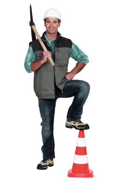 Man holding a pickaxe — Stock Photo, Image