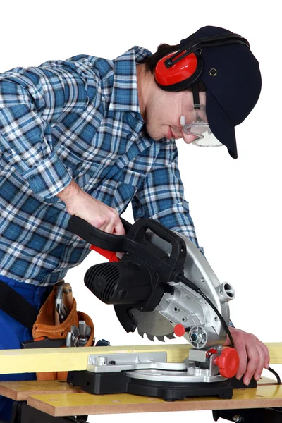 Man using a miter saw — Stock Photo, Image
