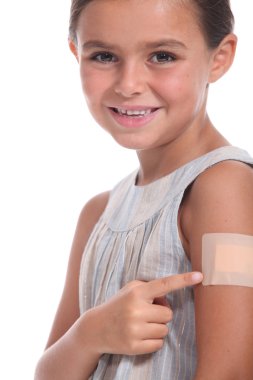 Young girl pointing to a plaster clipart