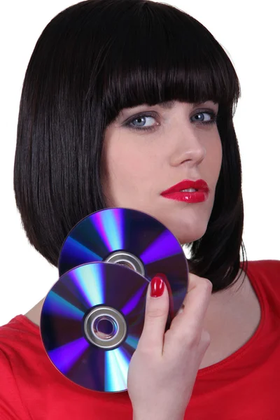 Genç bir kadın tutarak CD'leri — Stok fotoğraf