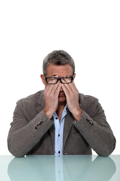 A middle aged man with a headache. — Stock Photo, Image