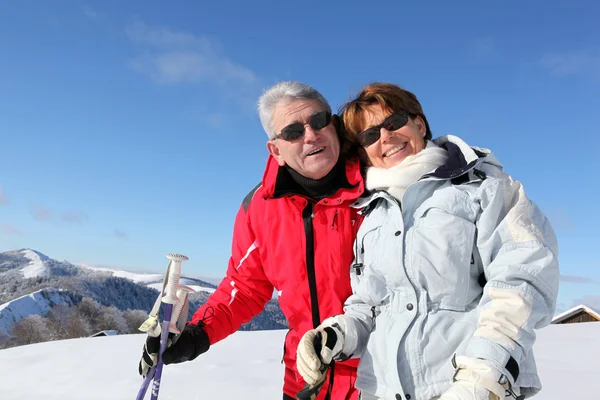 Senior couple in the snow — Stock Photo, Image