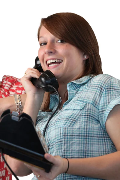 Счастливая девушка со стационарным телефоном — стоковое фото