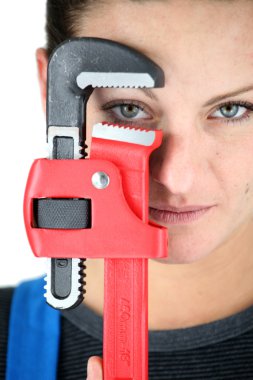Craftswoman holding a spanner clipart