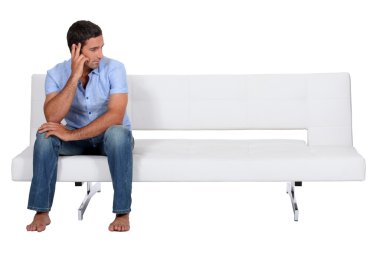 Man alone on the couch clipart