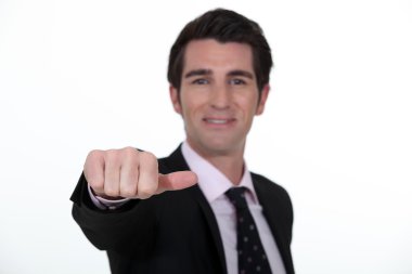 Businessman sticking out his thumb clipart