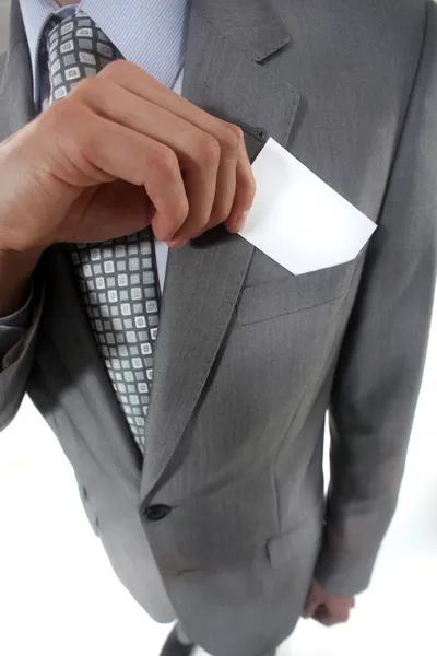 Businessman pulling a business card out of his pocket — Stock Photo, Image