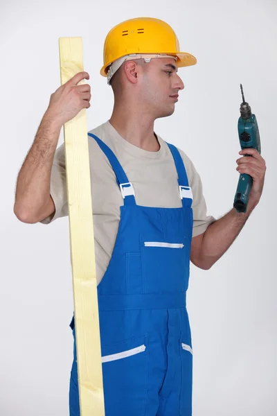 Man looking at drill — Stock Photo, Image