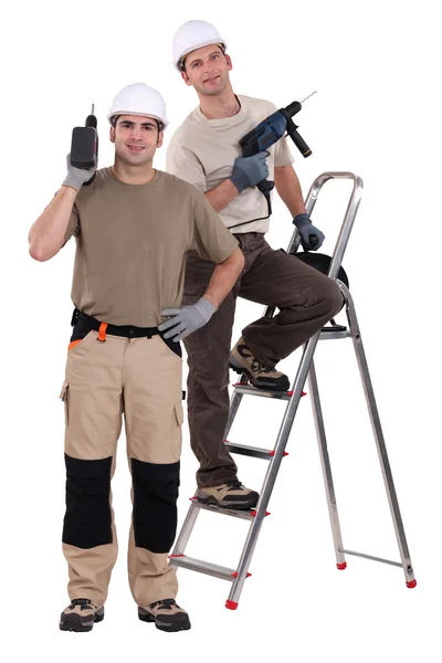 Craftsmen working with a drill — Stock Photo, Image