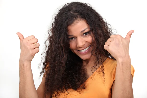 Thumbs up from a happy woman — Stock Photo, Image