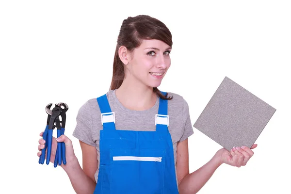 Woman with some pliers and a tile — Stock Photo, Image