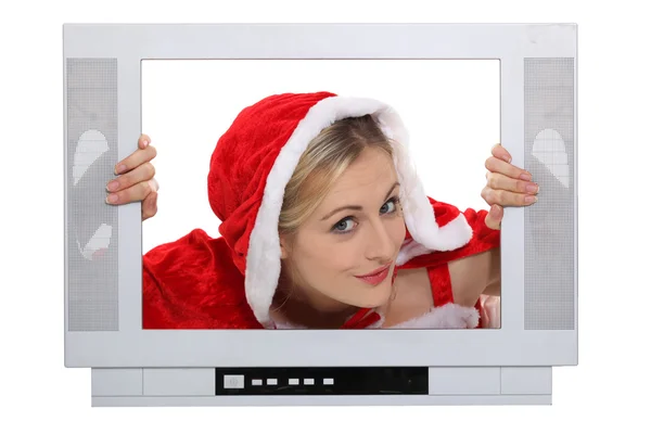 Woman in festive costume escaping from television — Stock Fotó