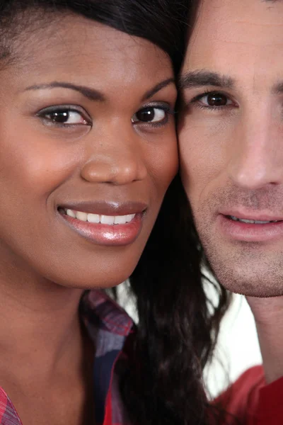 Closeup on the faces of a young couple — Stock Photo, Image