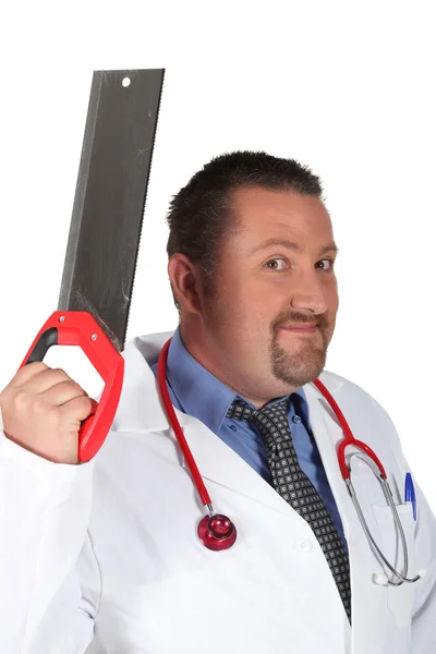 Doutor com uma serra manual — Fotografia de Stock