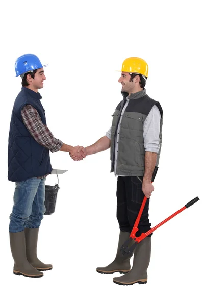 Two manual workers greeting each other — Stock Photo, Image