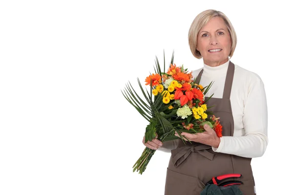 Жінка з купою квітів — стокове фото