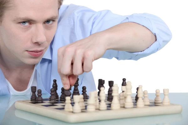 Young man playing chess — Stock Photo, Image