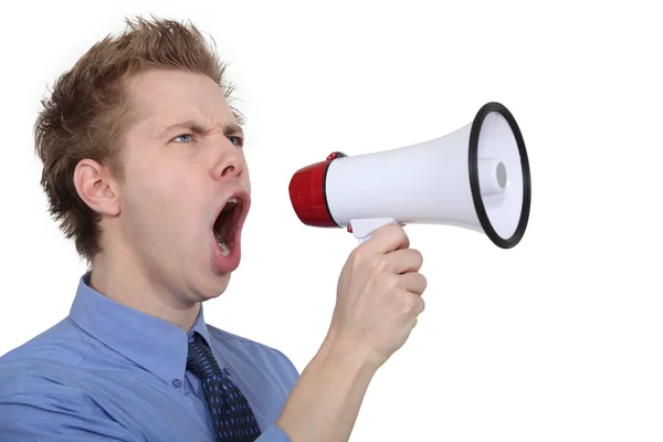 Man shouting through a megaphone — Stock Photo, Image