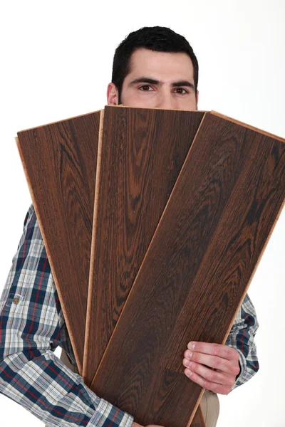 Muž s dřevěnou podlahou — Stock fotografie
