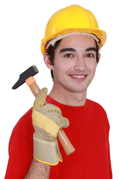 Jovem construtor com um martelo — Fotografia de Stock