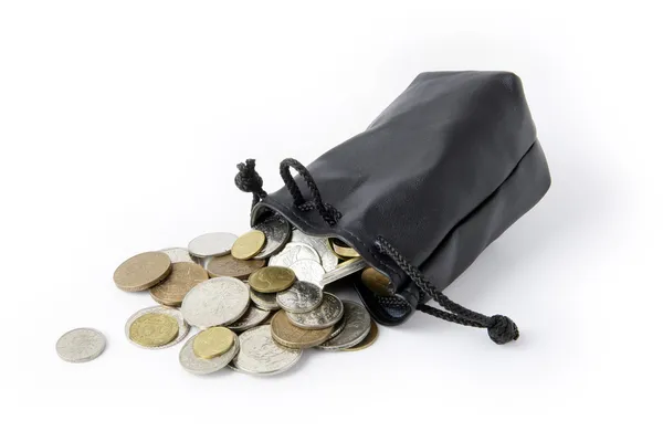 Coins falling from string purse — Stock Photo, Image