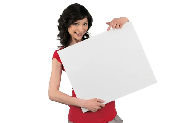 Atrakcyjna kobieta trzyma znak puste — Zdjęcie stockowe