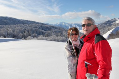 Couple going cross-country skiing clipart