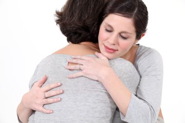 Two women hugging clipart