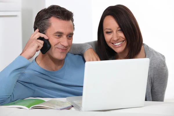 Couple shopping over the telephone — Stock Photo, Image