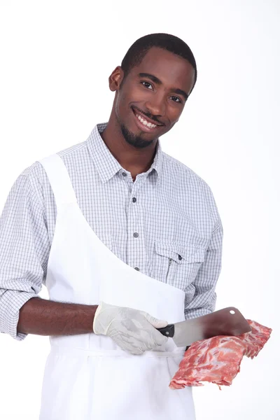 Butcher with a rack of ribs — Stock Photo, Image