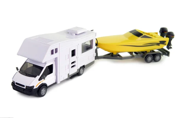 Camping vehicle pulling speed boat on trailer — Stock Photo, Image