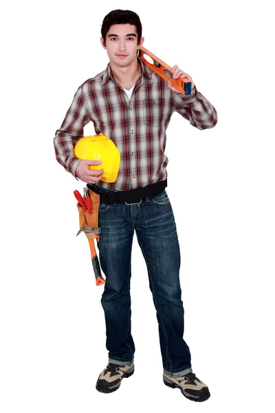 Builder with a spirit level — Stock Photo, Image