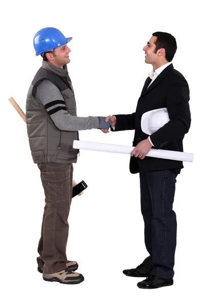 Workers holding hands — Stock Photo, Image