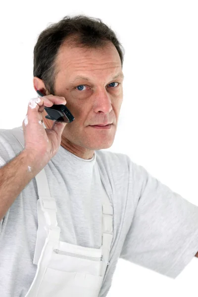 Decorator on the phone — Stock Photo, Image