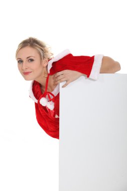 Woman leaning on a blank poster clipart