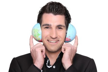Young man holding a globe clipart