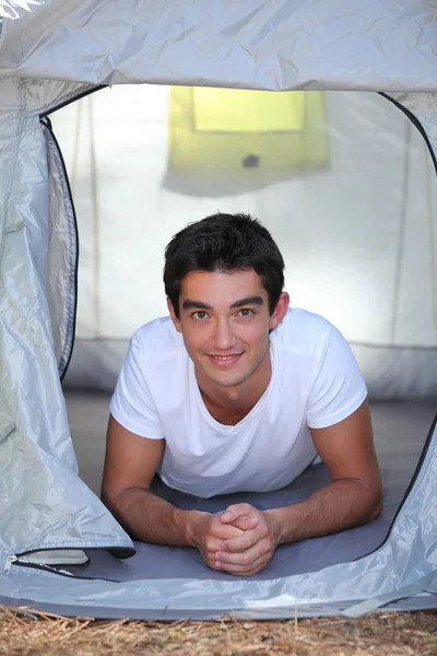 Boy lying in tent — Stock Photo, Image